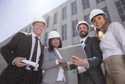 4 engineers checking papers and a tablet